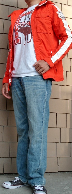 Casual Orange Hooded Jacket with White Graphic Tee and Light Wash Jeans