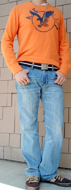 Casual Orange Long Sleeve Graphic Tee with Light Wash Jeans and Brown Sneakers