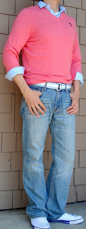 Preppy Coral Pink V-Neck Sweater Layered Over Light Blue Dress Shirt with Light Wash Jeans Outfit