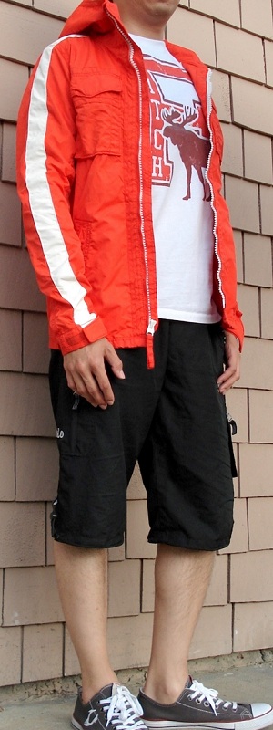 Sporty Orange Hooded Jacket with Graphic Tee and Black Shorts Outfit